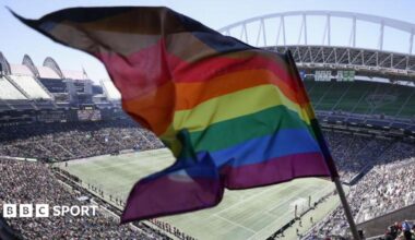A rainbow flag being flown at the Seattle Stadium.