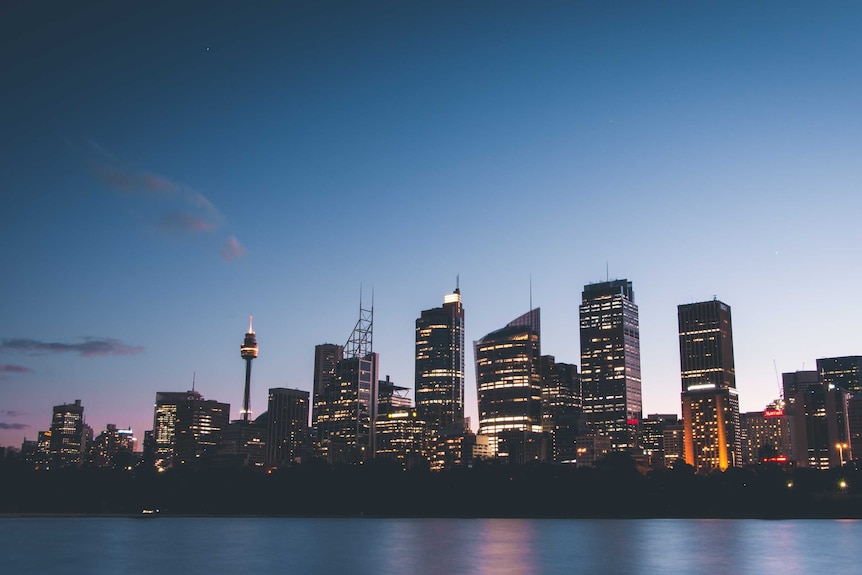A view of the Sydney skyline at dusk.