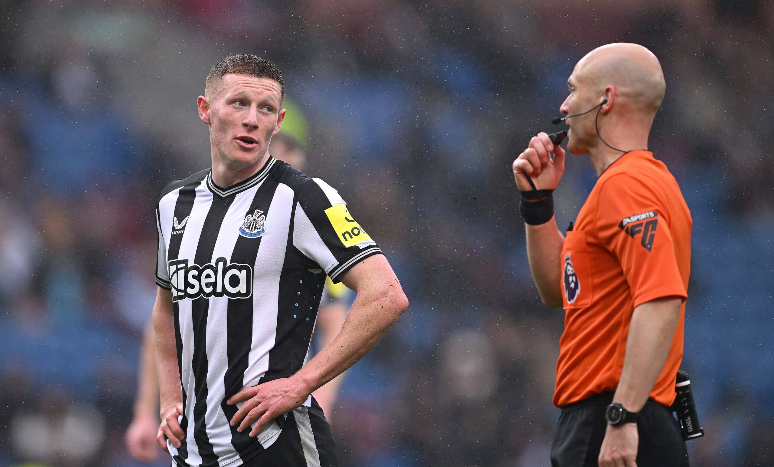 Anderson with his hands on his hips looking at referee Anthony Taylor