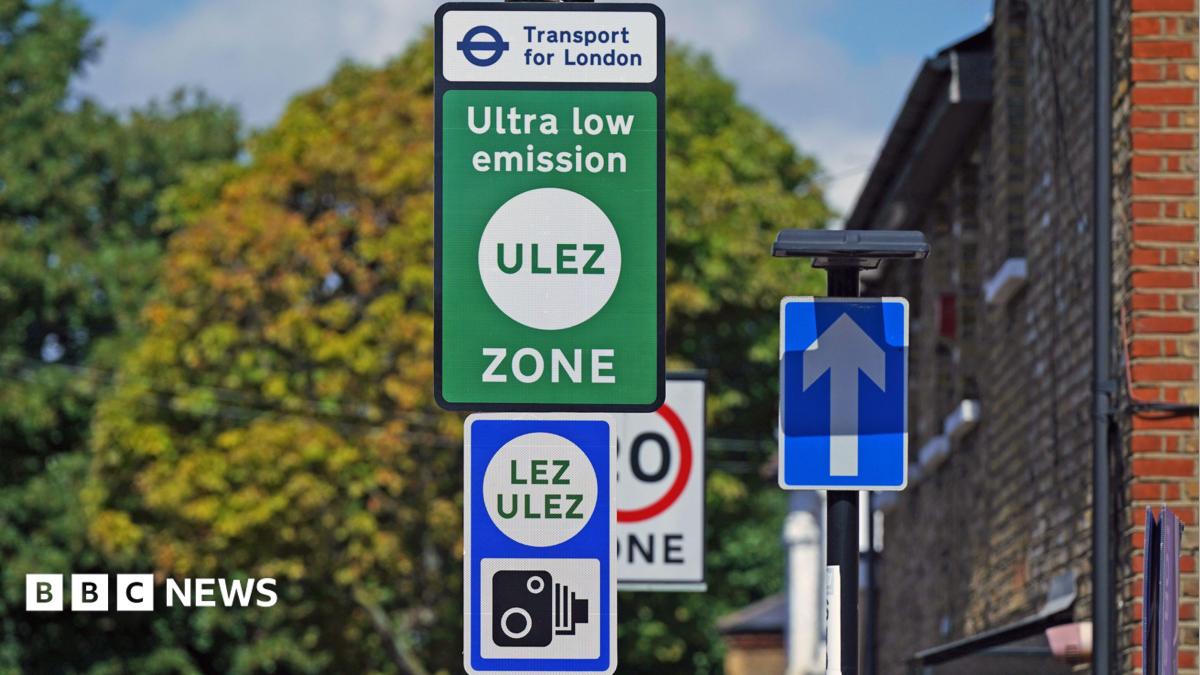 Green and blue Ulez sign with camera