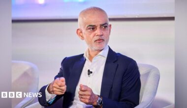 A side-by-side collage: On the left, Caitlin and Grace Leggett wear white bath robes and smile for a selfie. Caitlin has short, buzzed hair while Grace has long hair covered by a grey hair band. On the right, a Caitlin sleeps in a hospital bed, she has no hair left.