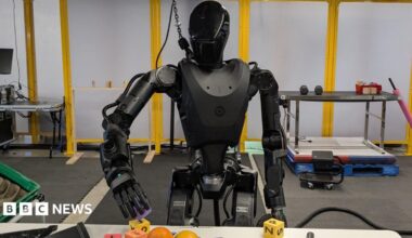 The all black Phantom robot handles building blocks.