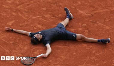 Alexander Zverev lies on the French Open clay after winning the 2026 title