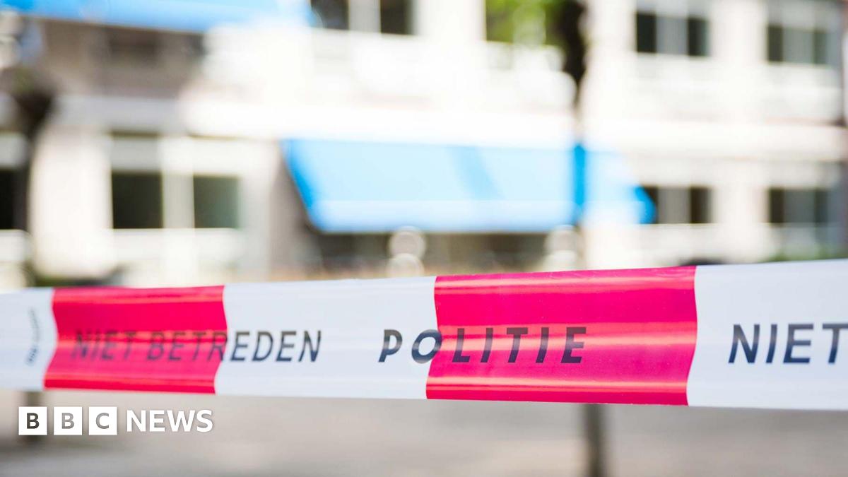 A stock image of white-and-red striped Dutch police tape, which reads 'Politie'.