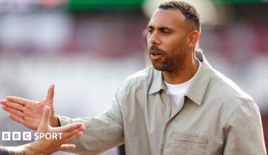 Anton Ferdinand shaking hands with a person off camera