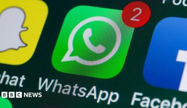 A WhatsApp logo displayed on a phone screen
