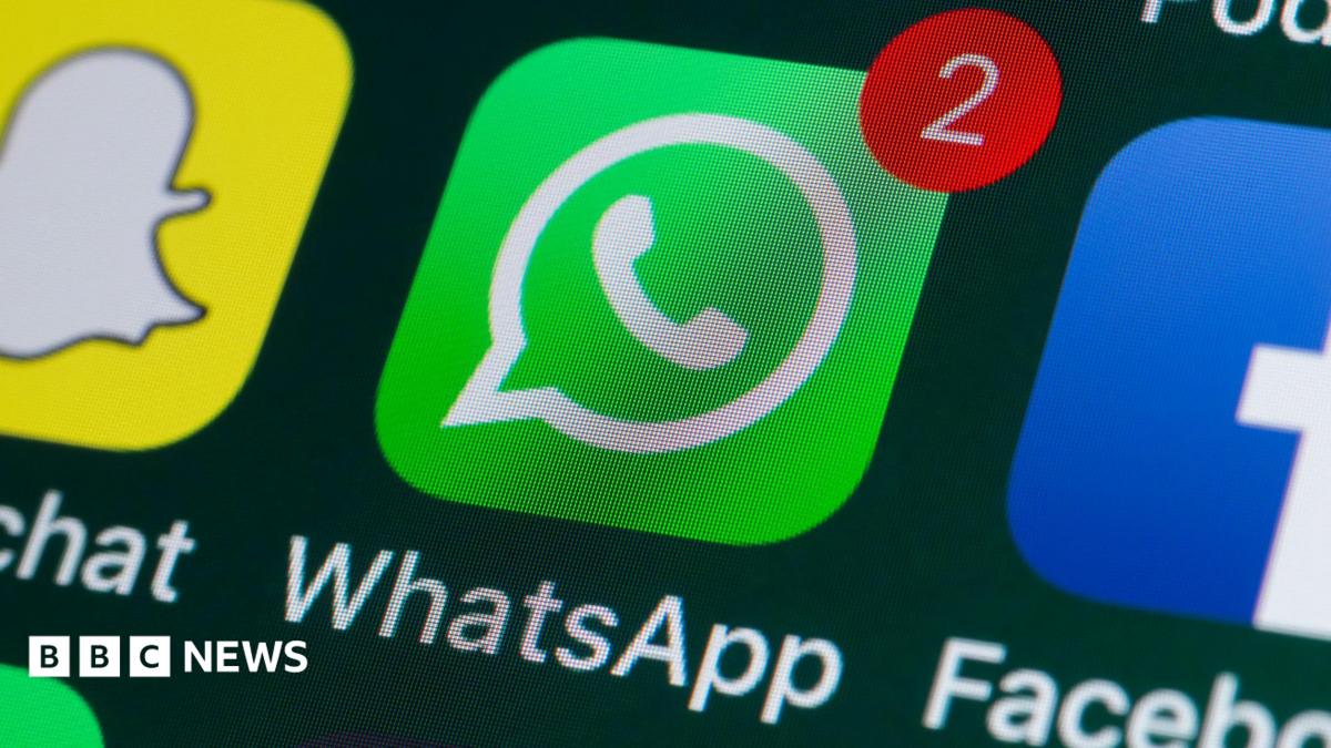 A WhatsApp logo displayed on a phone screen