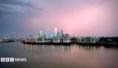 A lightning bolt is seen above building in Canary Wharf