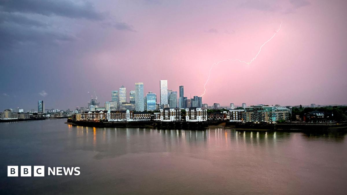A lightning bolt is seen above building in Canary Wharf