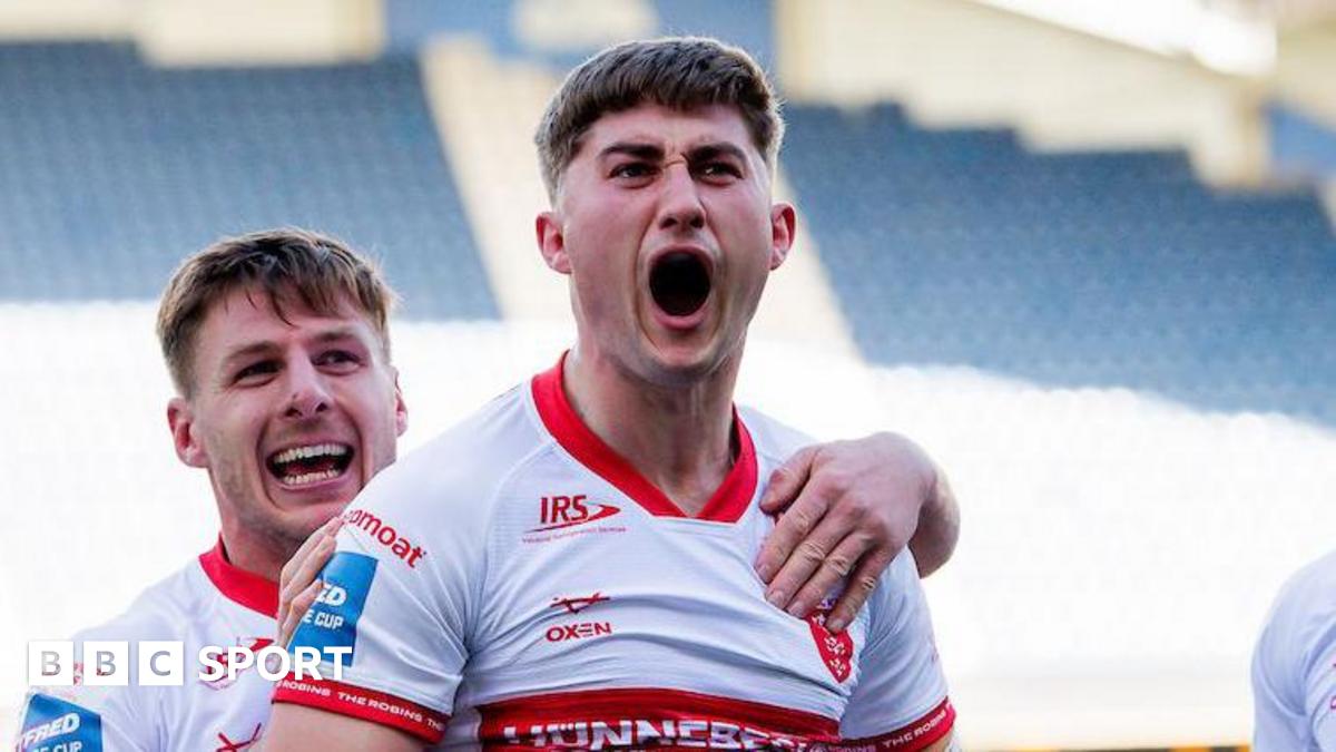Hull Kingston Rovers forward Tom Whitehead shouts in celebration after scoring a try against Huddersfield Giants, with grinning team-mate Tom Davies behind him and grabbing his shoulder.