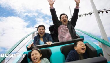 A stock image of a family enjoying a rollercoaster.