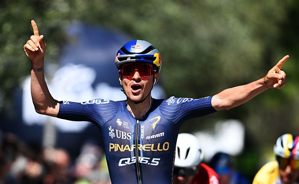 Tom Pidcock celebrates at the finish line as stage winner during the 48th Tour of the Alps 2026, Stage 3
