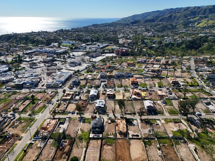 Empty lots line the streets of Pacific Palisades where homes destroyed by the Palisades Fire used to stand on March 7, 2026. Rebuilding from the devastating fire has been a slow process.