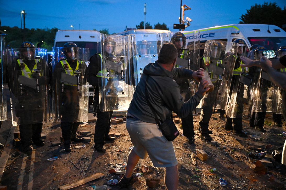 Protestors confront riot police during a demonstration over the police's handling of the fatal stabbing of Henry Nowak, in Southampton, England, on Tuesday.