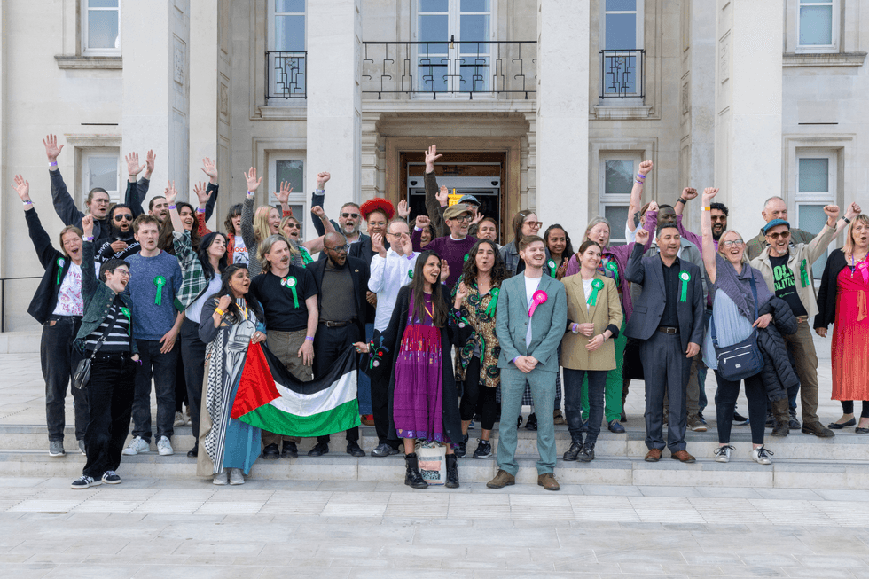 Green Party councillors celebrate with Faiza Shaheen in front of Waltham Forest Town Hall