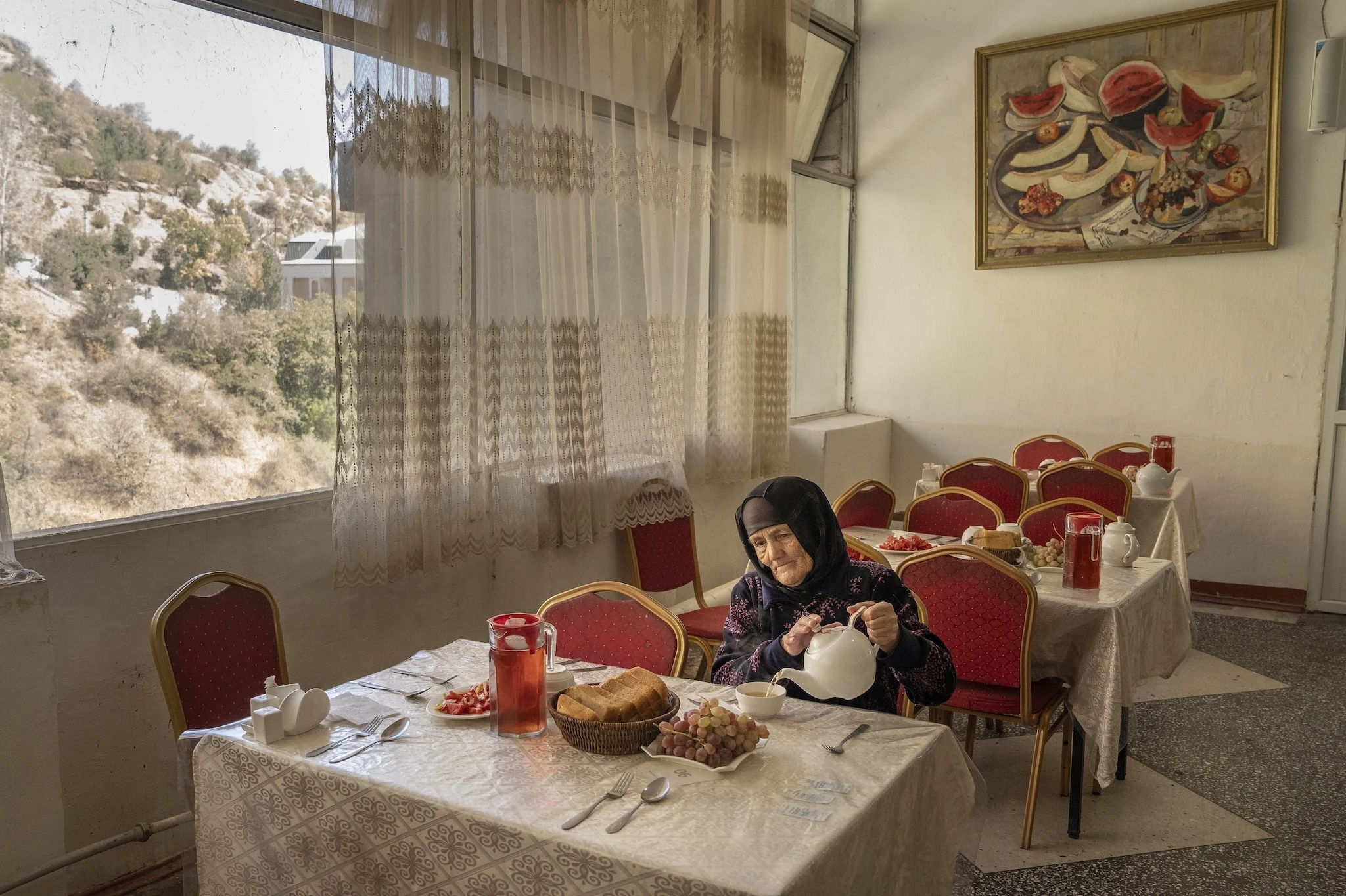 A Woman Eats in the Canteen of the Soviet-era Sanatorium