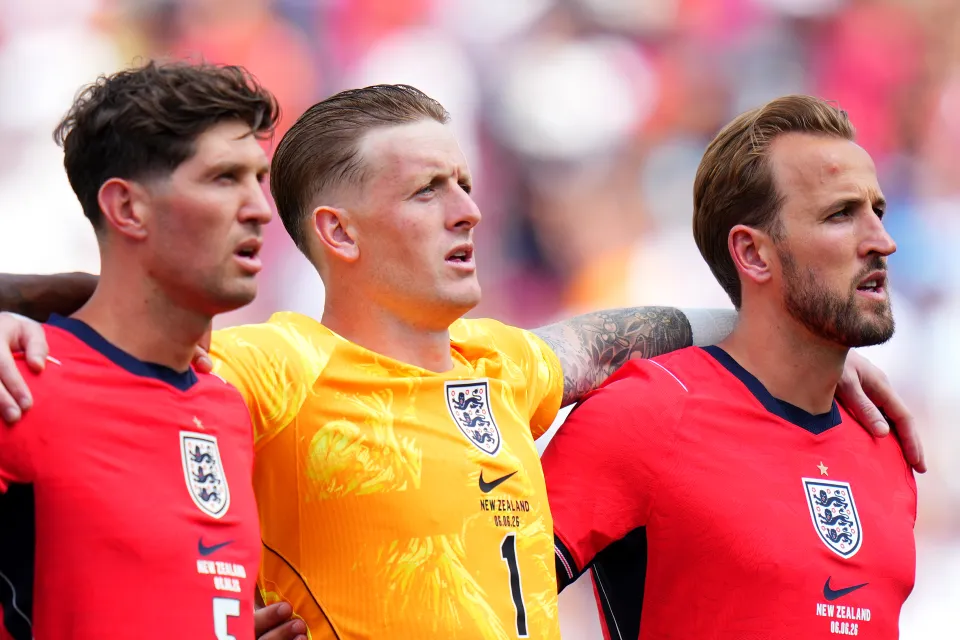 England's players sing the anthem
