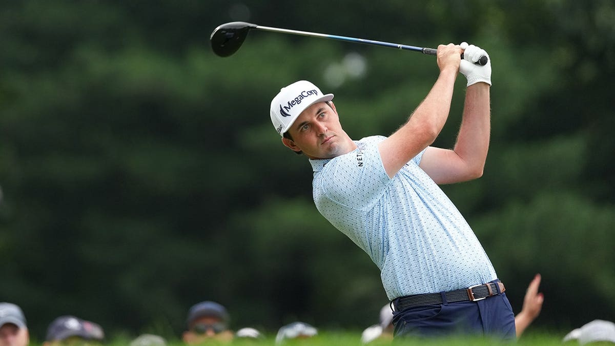J.T. Poston playing a tee shot on the first hole at TPC River Highlands in Cromwell, Connecticut