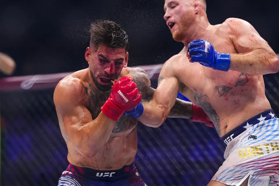 Ilia Topuria being struck by Justin Gaethje