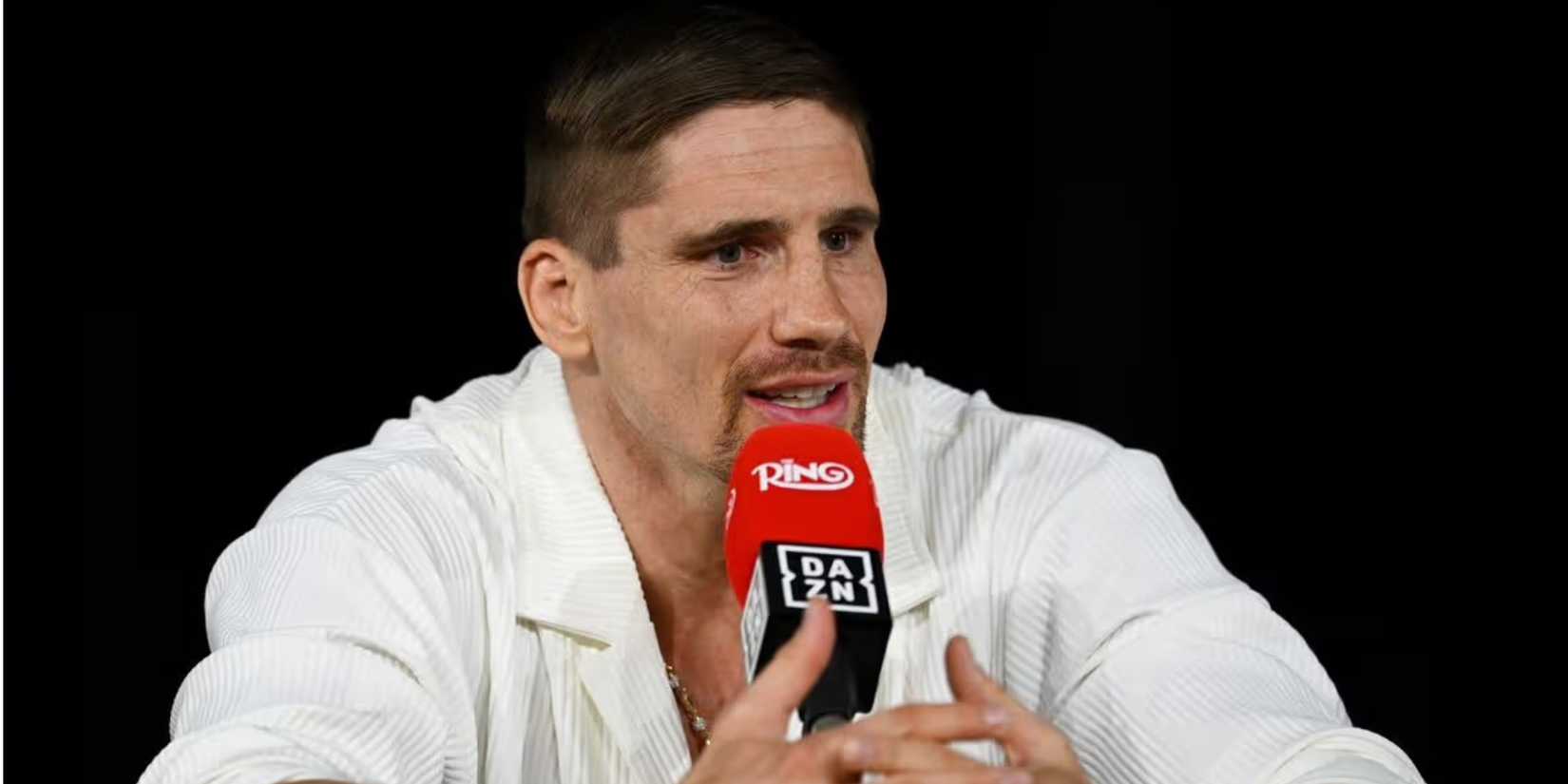 Rico Verhoeven on a microphone