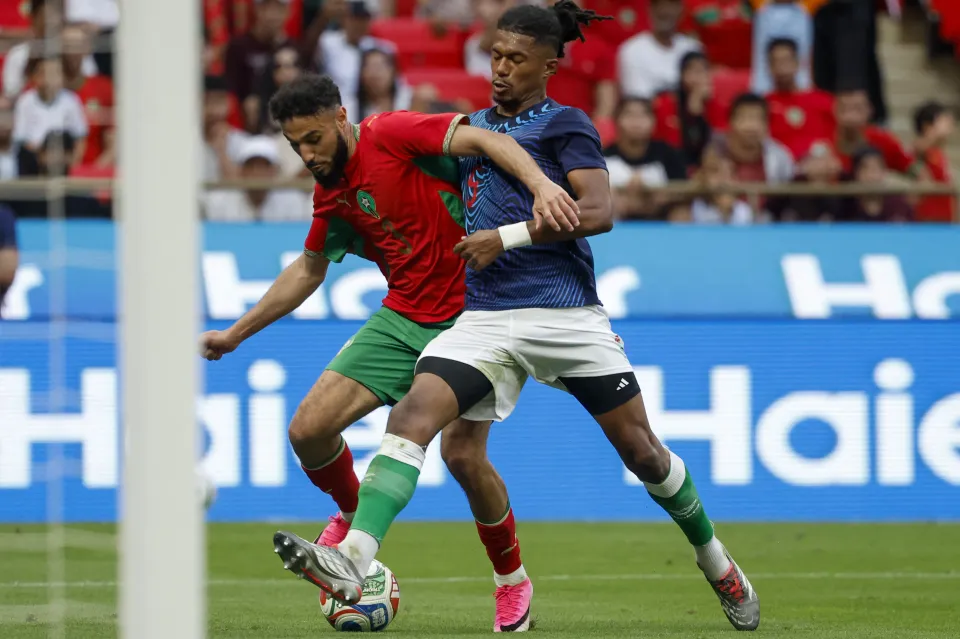 Noussair Mazraoui and Madagascar's player 05 Sandro Denis Tremoulet fight for the ball during the friendly football match between Morocco and Madagascar