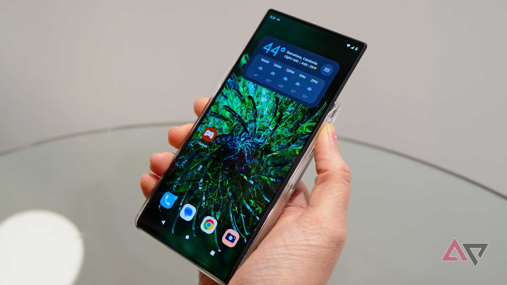 motorola rizr rollable phone concept in hand with the display extended