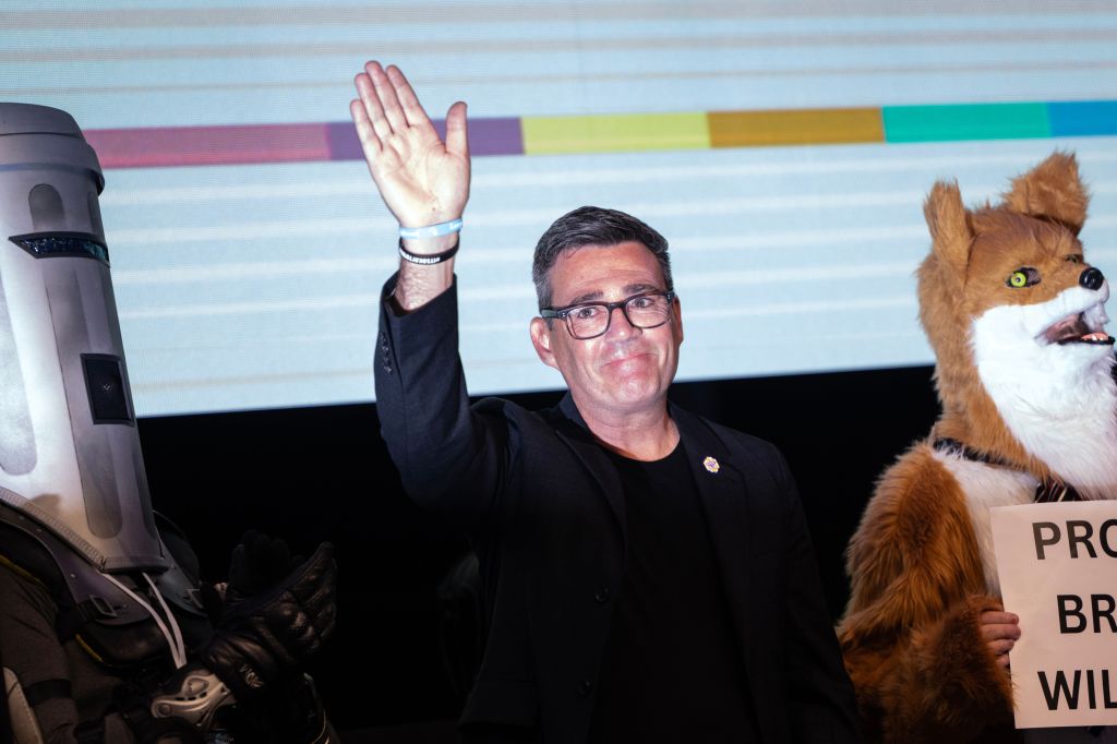 Newly elected Member of Parliament Andy Burnham waves to the crowd while delivering his victory speech.