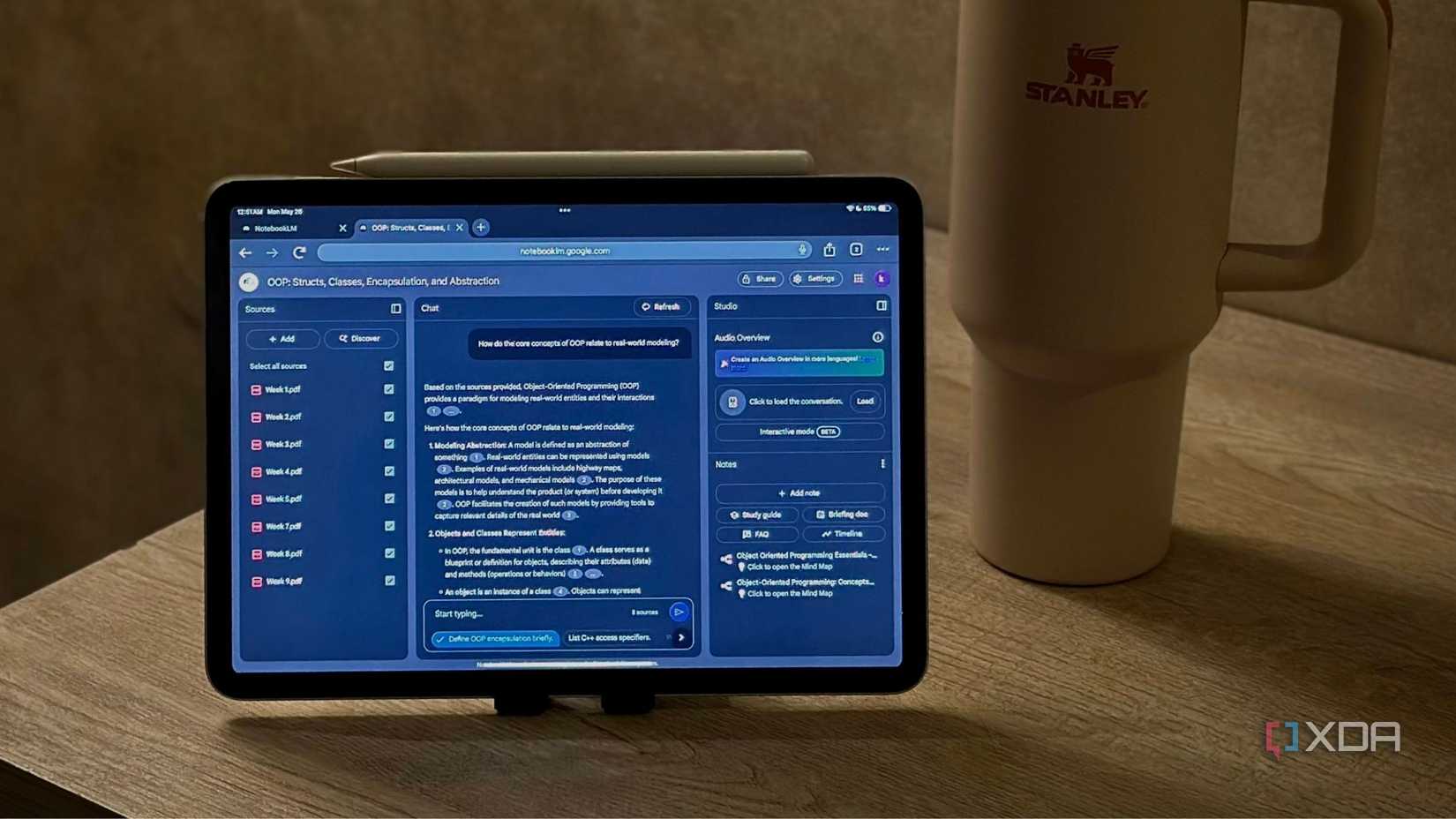 NotebookLM OOP notebook displayed on an iPad next to a Stanley