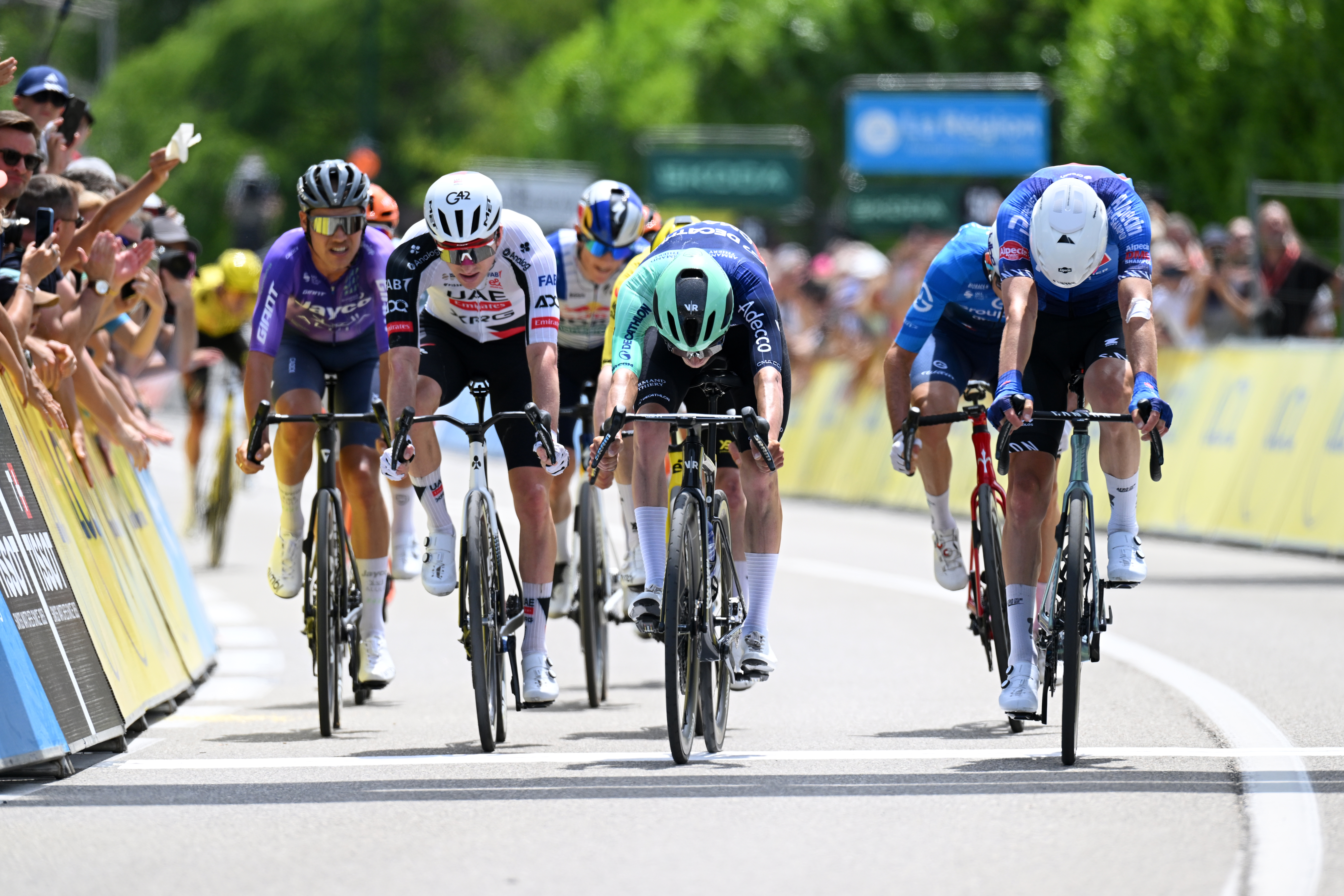 SAINT-ISMIER, FRANCE - JUNE 07: (L-R) Luke Plapp of Australia and Team Jayco AlUla, Kevin Vermaerke of United States and UAE Team Emirates - XRG, Leo Bisiaux of France and Team Decathlon CMA CGM and Ramses Debruyne of Belgium and Team Alpecin-Premier Tech sprint at finish line during the 78th Tour Auvergne-Rhone-Alpes 2026, Stage 1 a 146.2km stage from Vizille to Saint-Ismier / #UCIWT / on June 07, 2026 in Saint-Ismier, France. (Photo by Dario Belingheri/Getty Images)