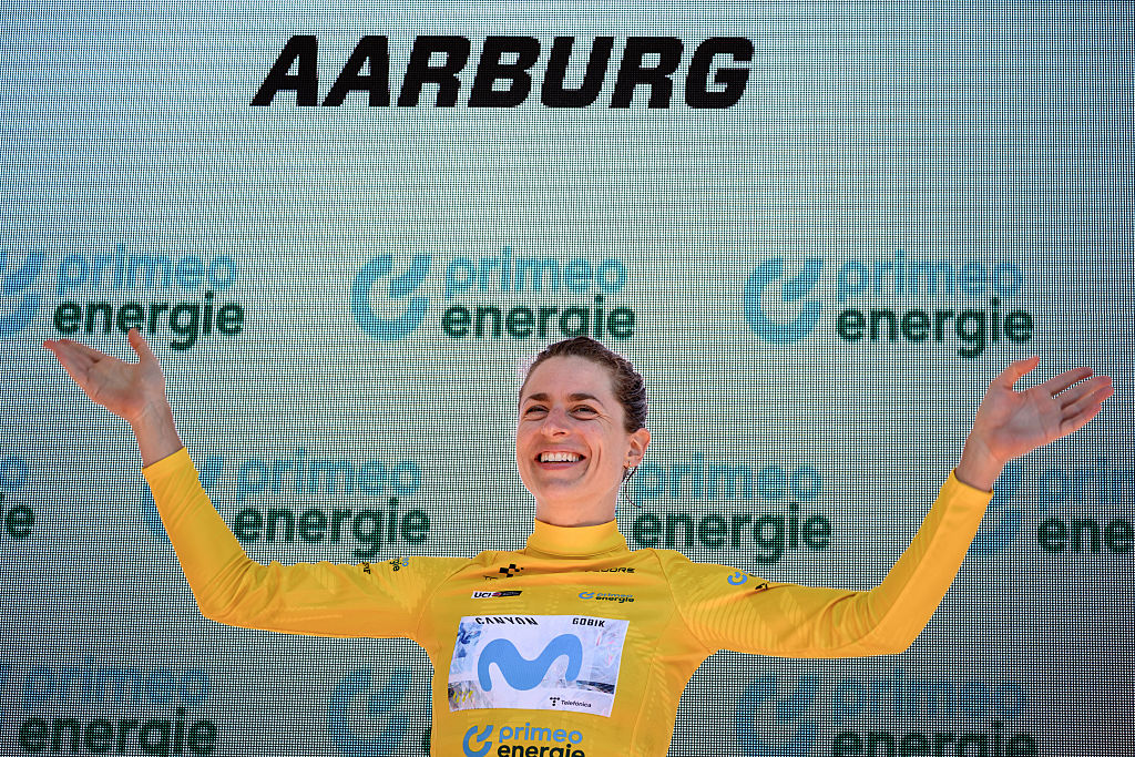 Switzerland's Marlen Reusser wearing the overall leader's yellow jersey celebrates on the podium after winning in the fourth stage, a 23,7 km time trial from Aarburg to Aarburg, at the Women&rsquo;s Tour of Switzerland (Tour de Suisse) cycling race in Aarburg, Switzerland, on June 20, 2026. (Photo by Fabrice COFFRINI / AFP)