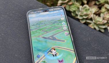 pokemon go on a smartphone on a concrete wall