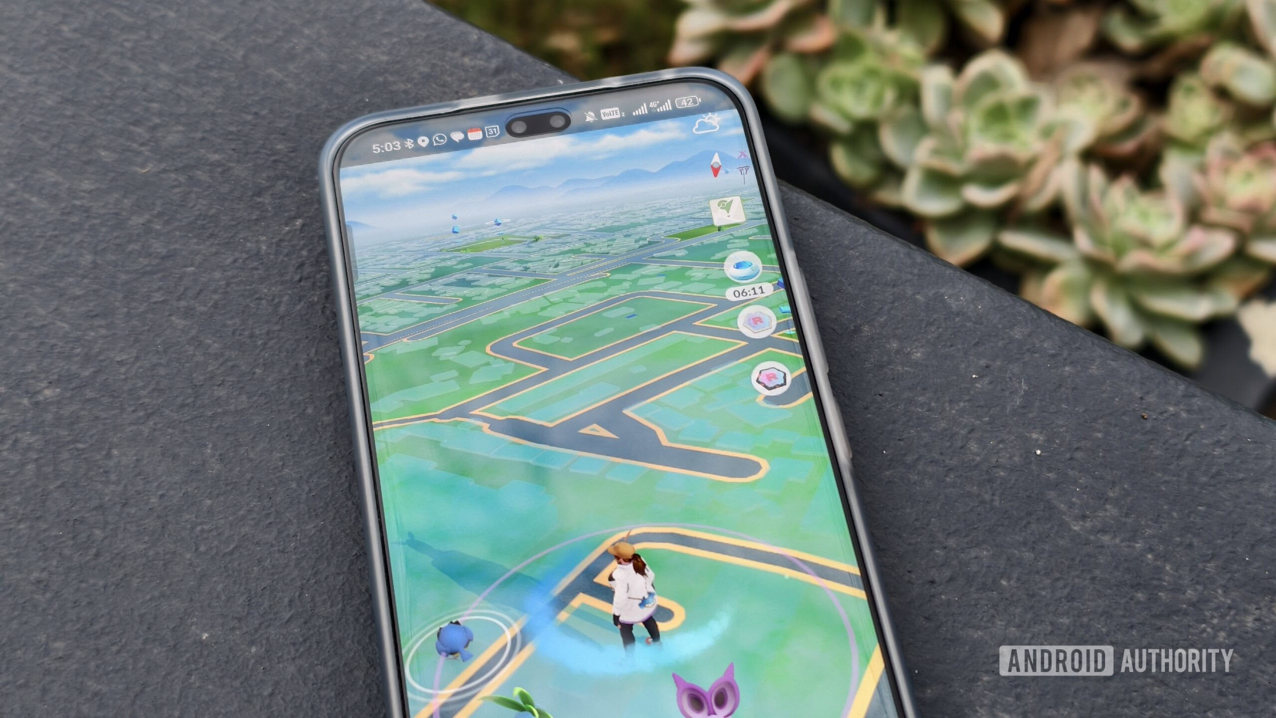 pokemon go on a smartphone on a concrete wall pokemon go on a smartphone on a concrete wall