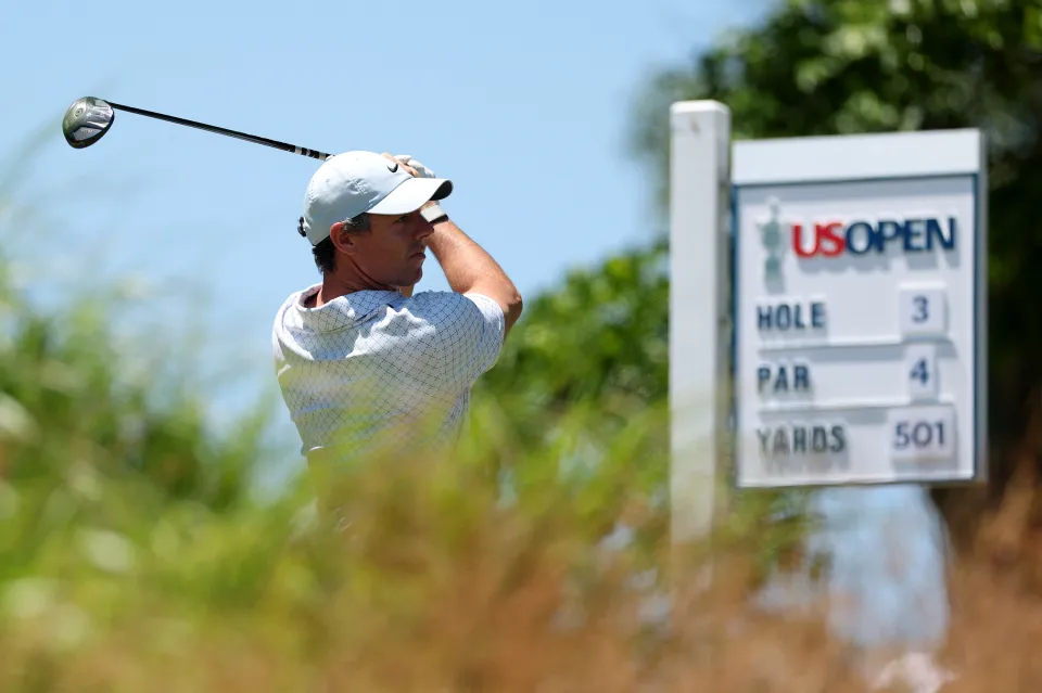 Rory McIlroy of Northern Ireland plays his shot from the third tee during the final round of the 126th U.S. OPEN at Shinnecock Hills Golf Club