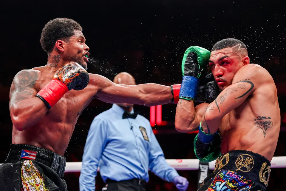 Shakur Stevenson punches Teofimo Lopez in the super lightweight bout for the World Boxing Organization title during The Ring 6 fight at Madison Square Garden