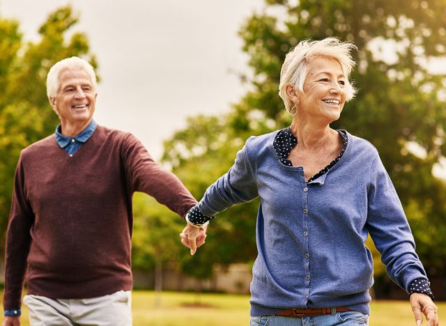 Love keeps a marriage alive. Shot of a happy senior couple going for a walk in the park.