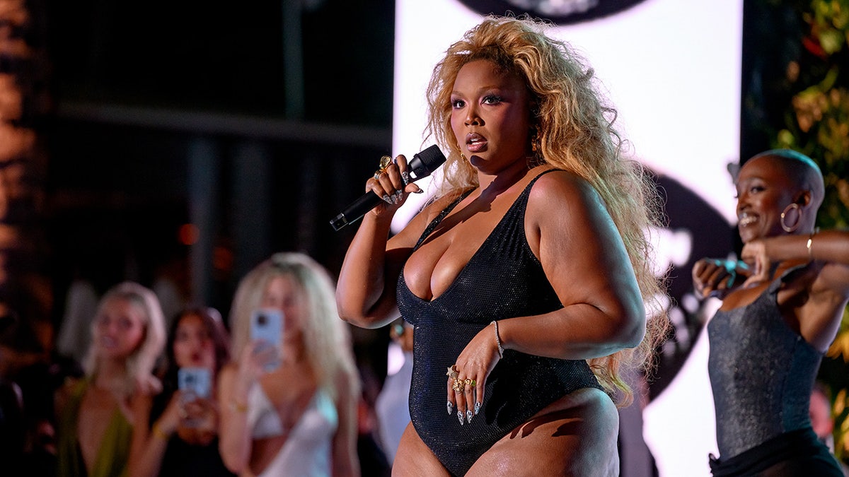 Lizzo performing on stage.