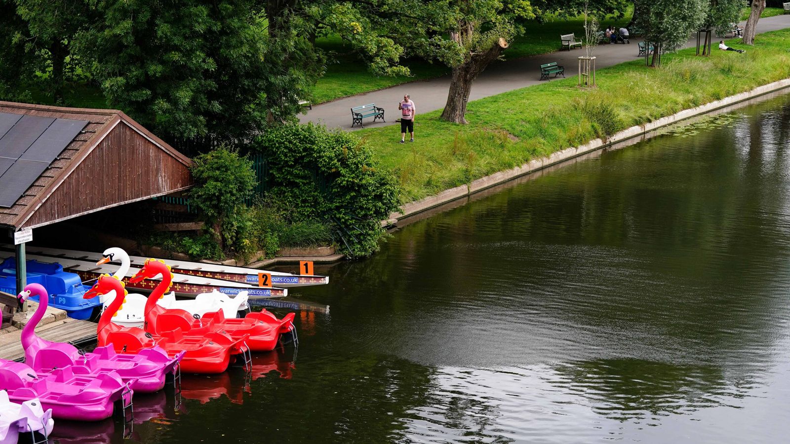 People walk by the River Avon in St Nicholas' Park in Warwick. Pic: PA