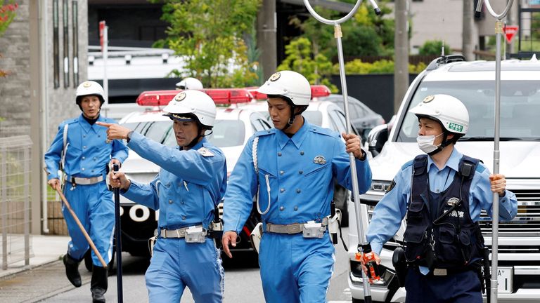 Police officers search for the bear. Pic: Reuters