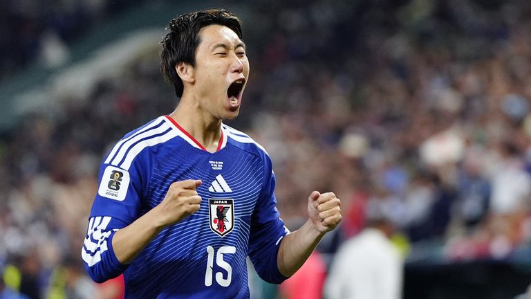 Japan's Daichi Kamada reacts after scoring the opening goal in the first half of a World Cup Group F football match against Tunisia