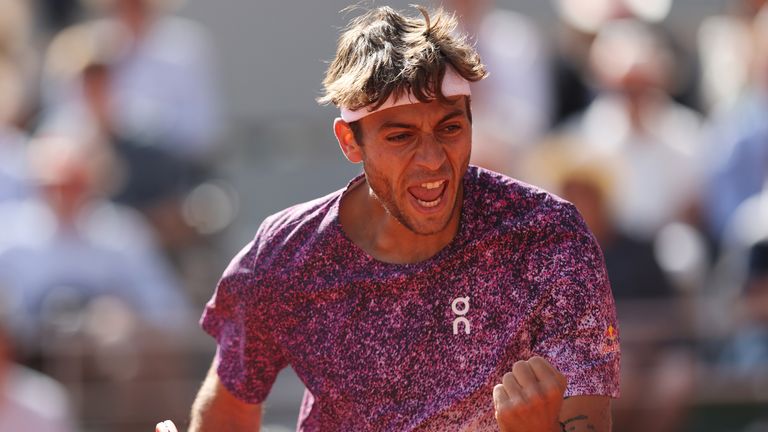 Flavio Cobolli of Italy celebrates a point against Alexander Zverev of Germany in the Men's Singles final match on Day Fifteen of the 2026 F