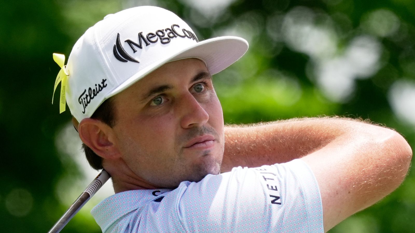 J. T. Poston watches his tee shot on the fifth hole during the final round of The Memorial