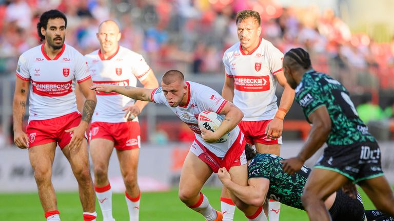 Hull KR's Mikey Lewis is tackled by Leigh