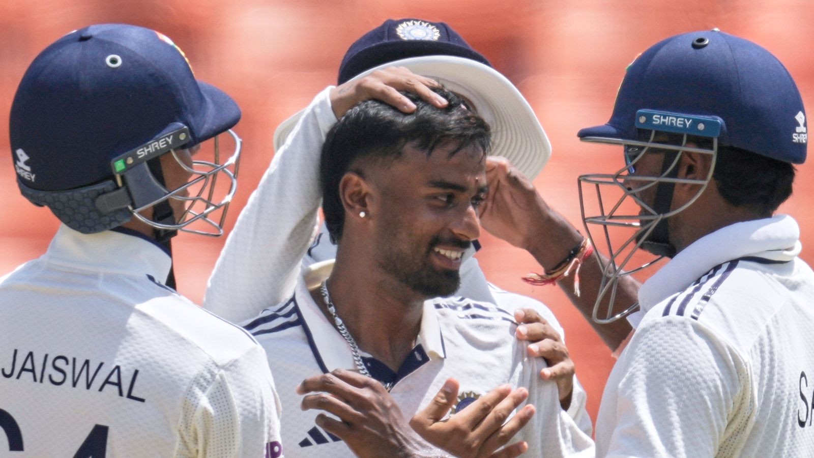 Manav Suthar (centre) took seven wickets on debut to lead India to their largest ever Test victory against Afghanistan