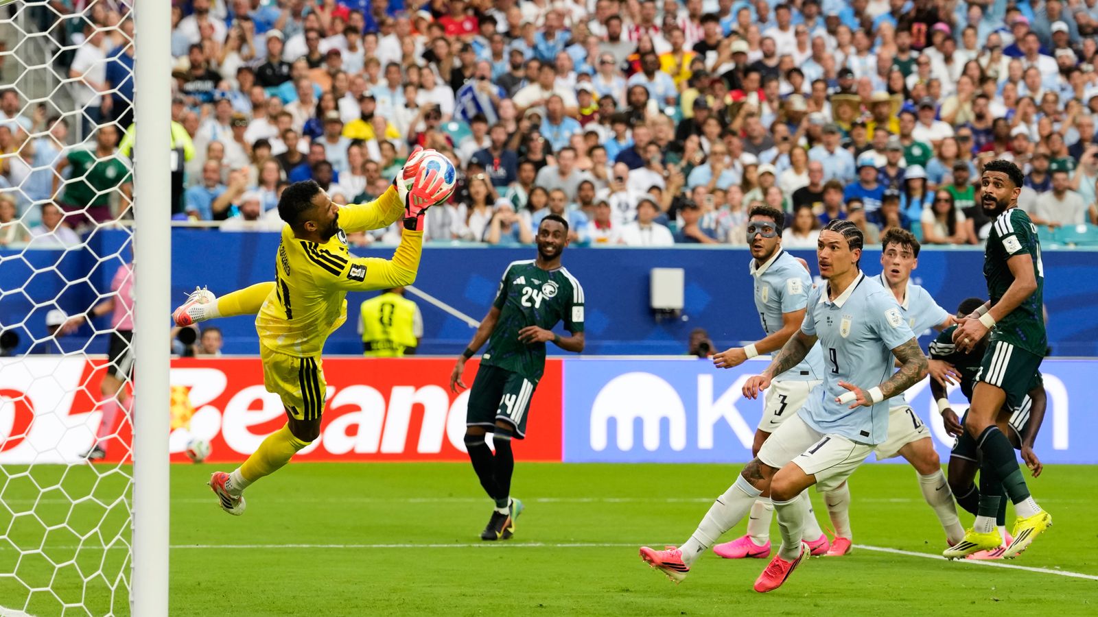Saudi Arabia goalkeeper Mohammed Al-Owais makes a save during the World Cup Group H soccer match against Uruguay