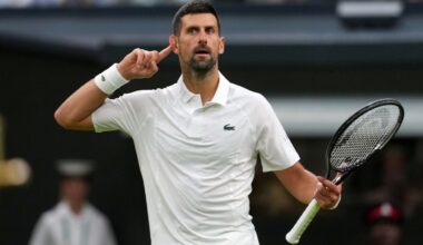 Novak Djokovic puts his finger to his ear after making a crucial break during his first-round battle at Wimbledon