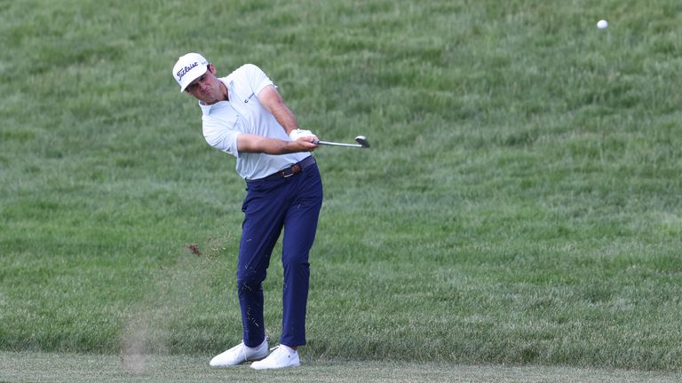 Suber hits an iron on the 18th