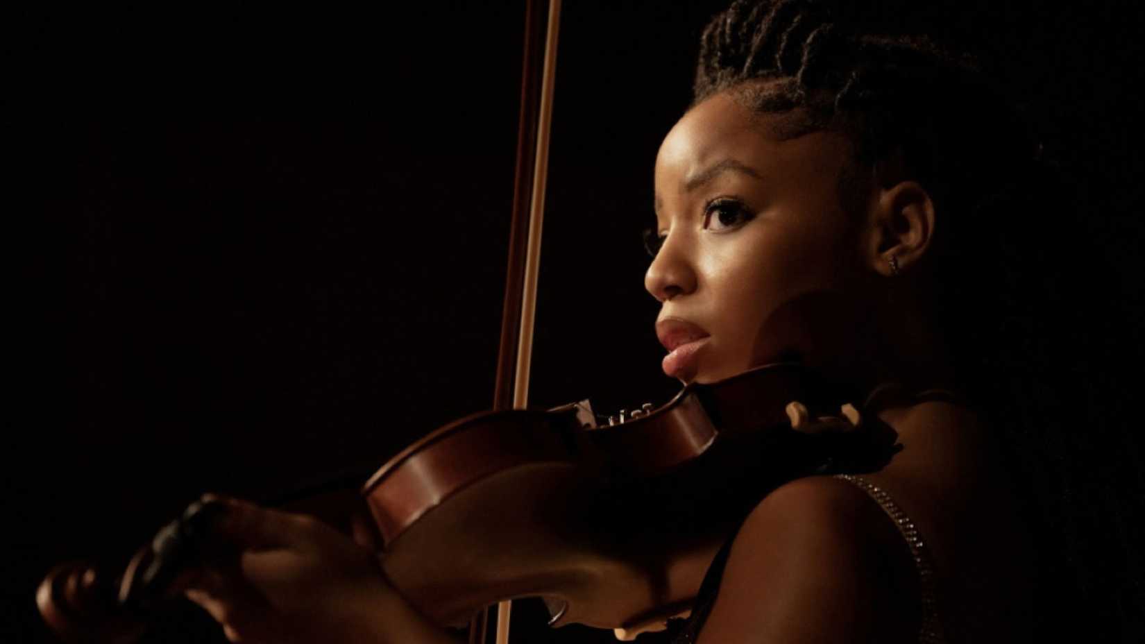 A woman playing the violin in the movie 'Strung'