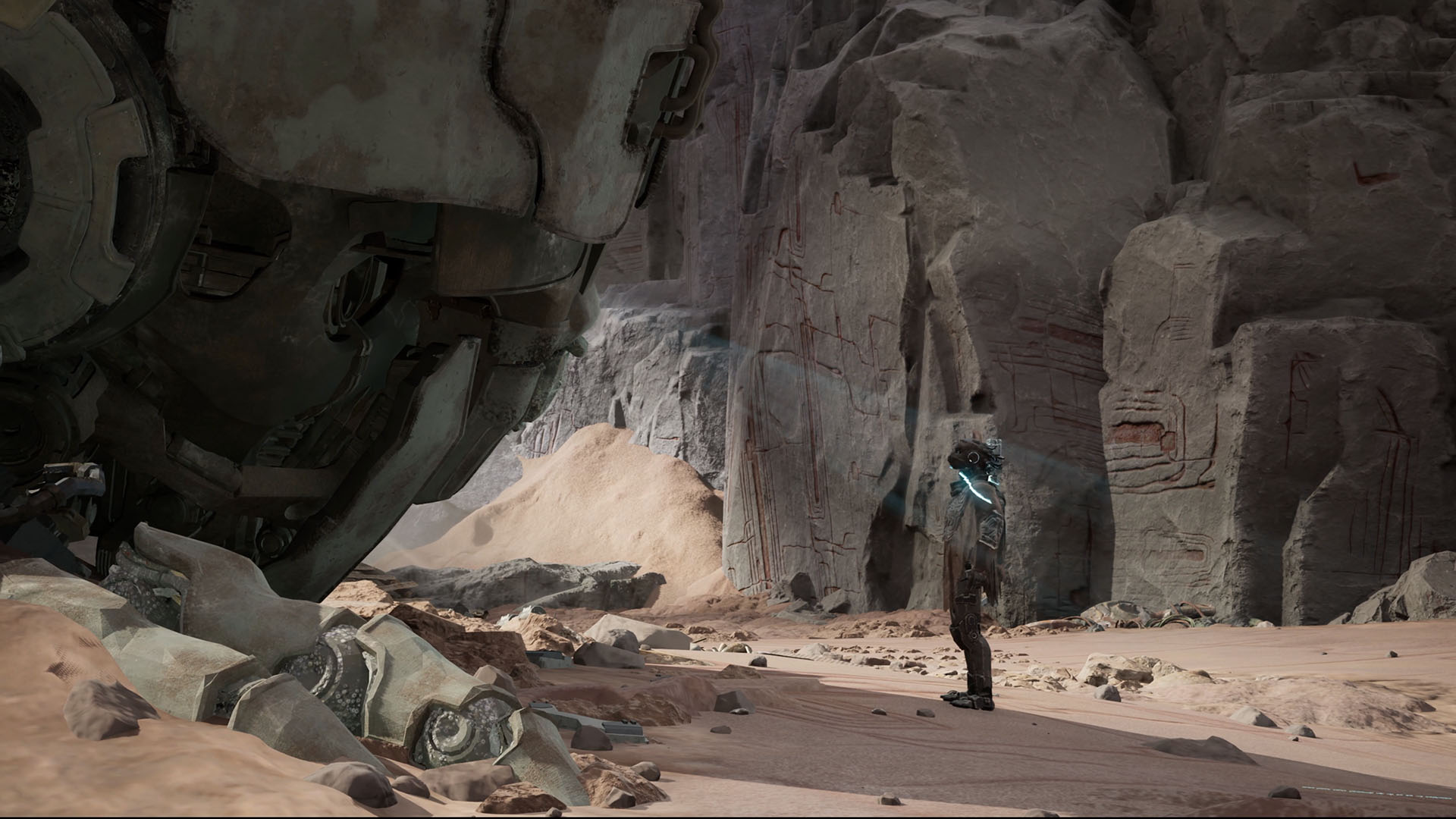 Gen Atlas - A humanoid figure standing in sandy ruins, looking up at an abandoned part of a mech.