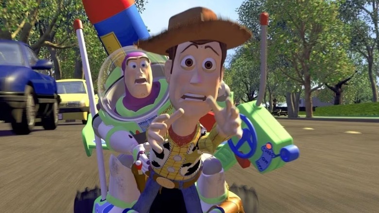 Woody reaching out in the climactic chase scene of 