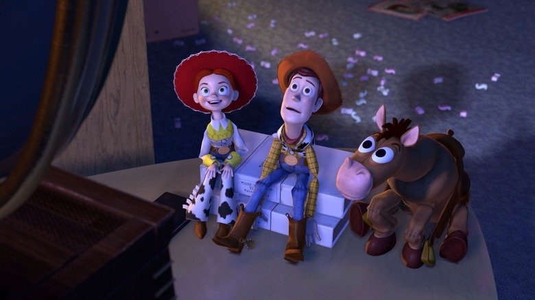 Jessie, Woody, and Bullseye watching a Woody's Round-Up episode in "Toy Story 2" (1999)